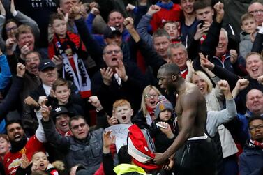 Manchester United's fans celebrate with goalscorer Romelu Lukaku at Old Trafford on Saturday during the win over Southampton. United have announced season ticket prices will remain unchanged for the 2019/20 season. Reuters 