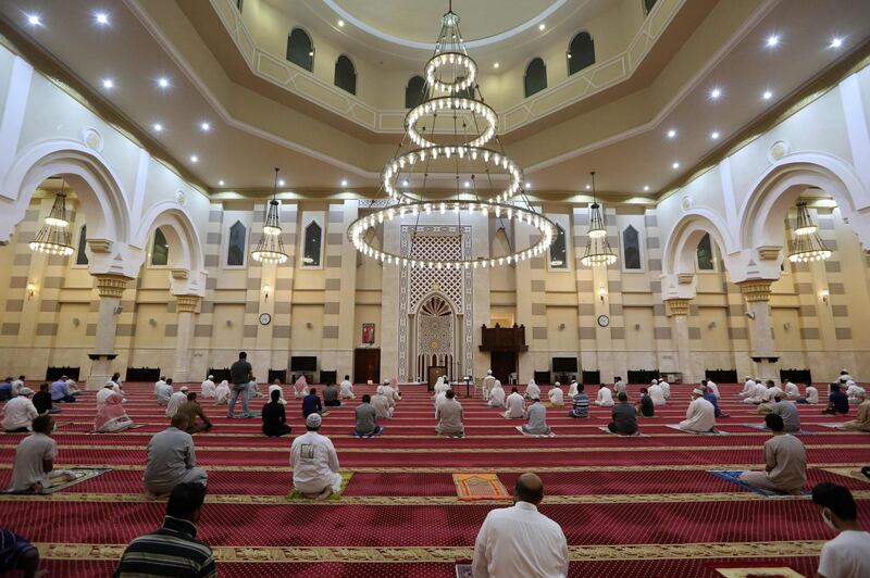Worshippers, keeping a safe distance from one another, perform the dawn prayer at a mosque in the Saudi holy city of Makkah.   AFP