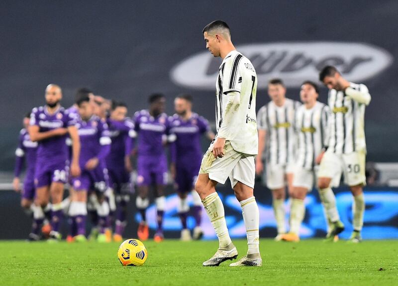 Cristiano Ronaldo looks dejected after Fiorentina celebrate their second goal from Juventus' Alex Sandro's own goal. Reuters