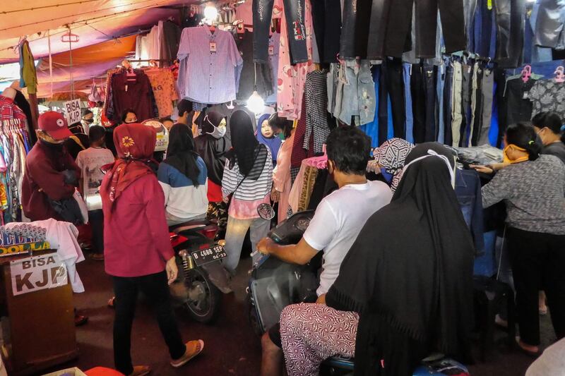 People purchase new clothes, a custom ahead of Eid Al Fitr a the end of Ramadan, at a shopping centre in Jakarta. AFP