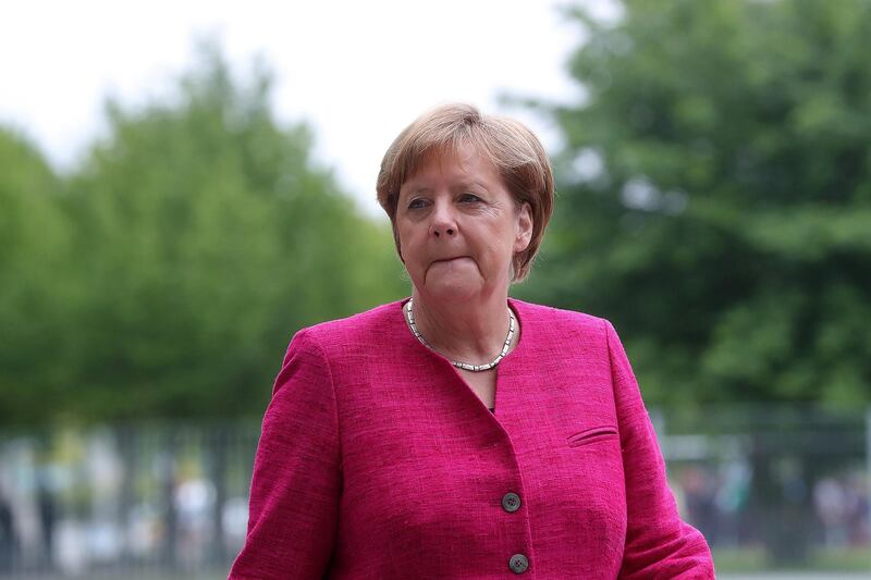 Angela Merkel, Germany's chancellor, awaits the arrival of Pedro Sanchez, Spain's prime minister, outside the Chancellery building in Berlin, Germany, on Tuesday, June 26, 2018. Merkel topped migration hard-liners in a popularity poll in Bavaria, suggesting she still has room to maneuver in a government rift over border security. Photographer: Krisztian Bocsi/Bloomberg