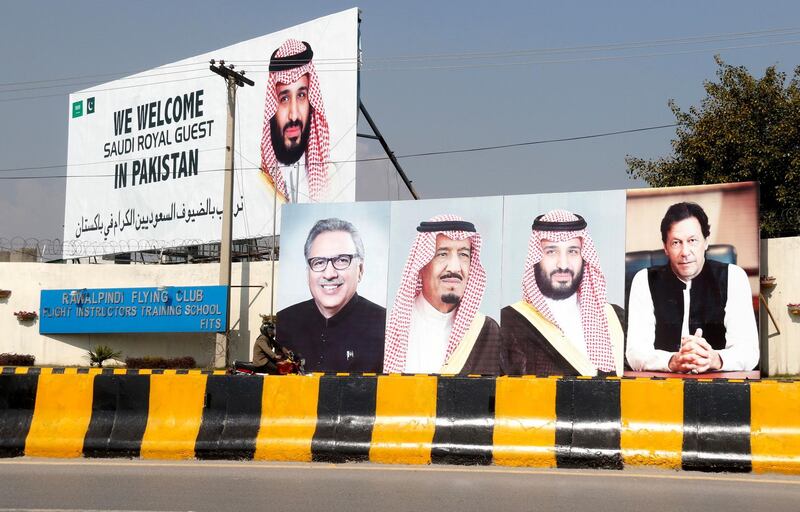 Billboards showing Arif Alvi, President of Pakistan, Mohammad Bin Salman and Pakistani Prime Minister Imran Khan, are displayed on roads in Islamabad. EPA