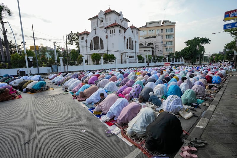 Eid prayers on a street in Jakarta, Indonesia. AP