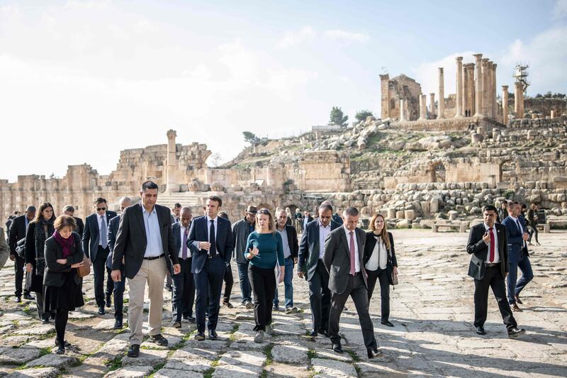 French President Emmanuel Macron, centre, visits the archaeological site of Jerash in Jordan. AFP