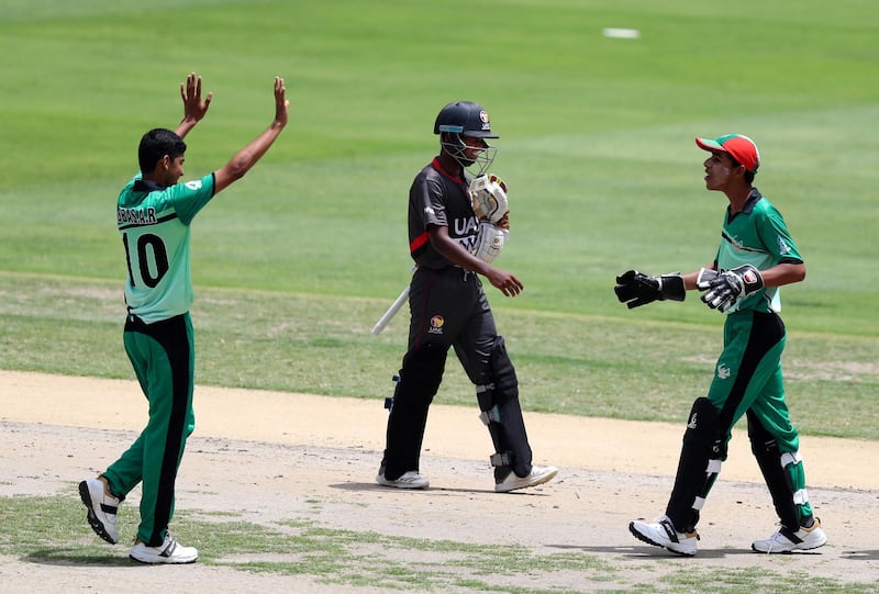 Dubai, United Arab Emirates - April 29, 2019: Iran's Abbas Ali Raeisi takes the wicket of UAE's Anand Kumar in the game between UAE U19's and Iran U19's in the Unser 19 Asian Cup qualifiers. Monday the 29th of April 2019. Dubai International Stadium, Dubai. Chris Whiteoak / The National