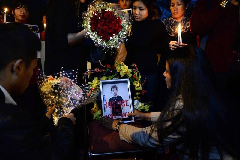 Students from India's north-eastern states and supporters give a floral tribute to Nido Tania, a student from Assam who died after being assaulted in New Delhi last week. Sajjad Hussan / AFP

