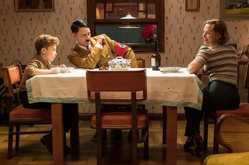 Roman Griffin Davis, Taika Waititi and Scarlett Johansson in a scene from 'Jojo Rabbit'.