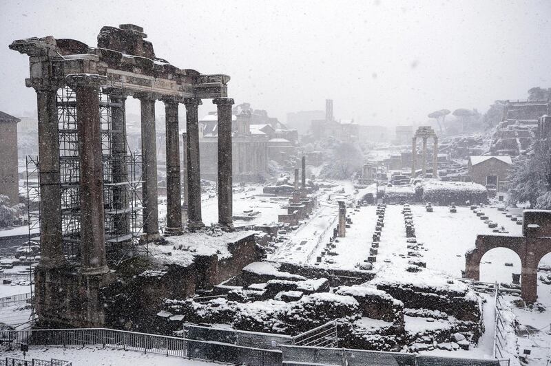 The Fori Imperiali is covered by snow during a snowfall in Rome, Italy, on February 26, 2018. Schools and public offices were closed and snow-removal crews were in place as Rome was on high alert for a first winter blast. Snowfall last week in Rome brought the capital to a standstill for days.  Angelo Carconi / EPA