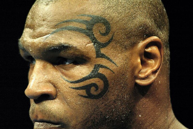 MEMPHIS, TN - FEBRUARY 22:  A close-up of Mike Tyson and his newest tattoo during his heavyweight bout against Clifford Etienne at The Pyramid on February 22, 2003 in Memphis, Tennessee.  Tyson knocked out Etienne 49 seconds into the first round to win the bout. (Photo by Al Bello/Getty Images) 