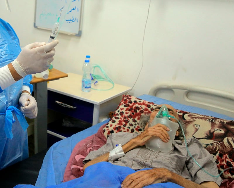 A coronavirus patient at a hospital in Najaf, Iraq. Infections in Iraq have surged to record highs during a third wave spurred by the more aggressive delta variant. Hospitals neglected by decades of war are overwhelmed with severely ill patients.