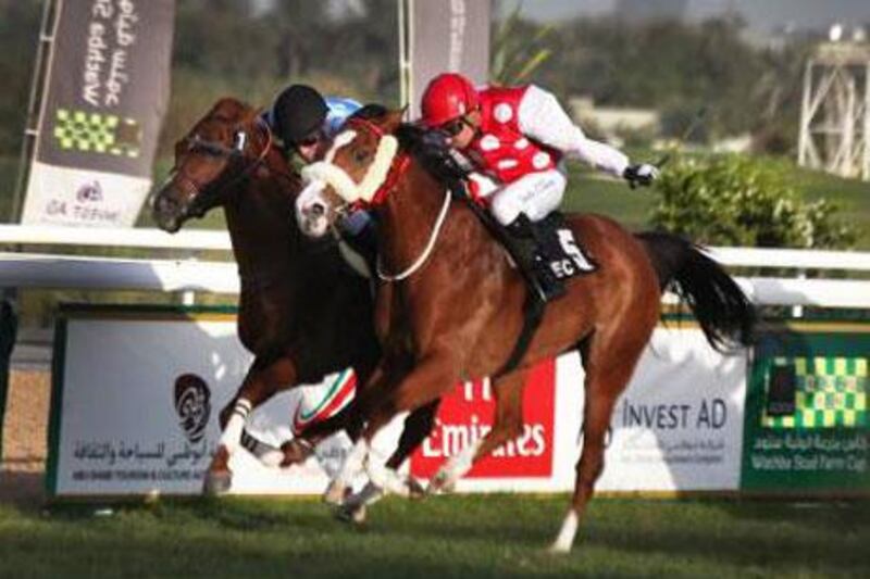 Richlore, right, was the second of four winners jockey Tadhg O'Shea rode at Abu Dhabi Equestrian Club on Sunday night.