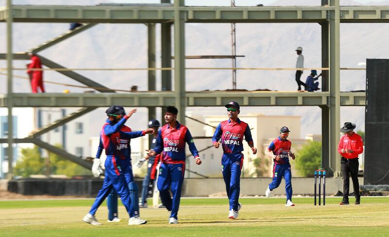 Nepal's Sandeep Lamichhane celebrates taking the wicket of United States opener Sushant Modani