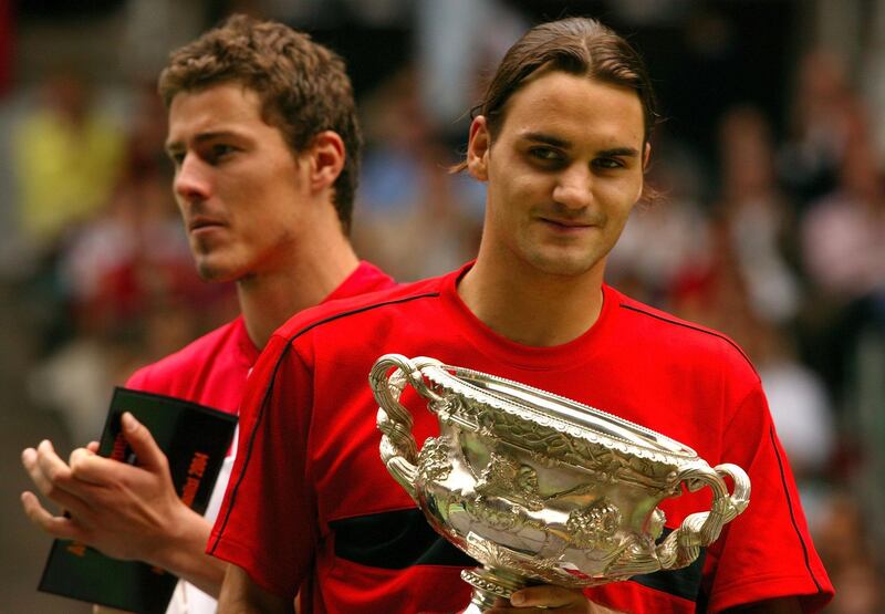 MELBOURNE, AUSTRALIA - FEBRUARY 1:  Marat Safin of Russia poses with Roger Federer of Switzerland after the Mens Singles Final during day fourteen of the Australian Open Grand Slam at Melbourne Park February 1, 2004 in Melbourne, Australia.  (Photo by Nick Laham/Getty Images)