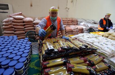 Food supplies being packaged at a centre run by Hezbollah during a media tour organised by Hezbollah officials, as the spread of coronavirus disease (COVID-19) continues, in Beirut's southern suburb, Lebanon March 31, 2020. Picture taken March 31, 2020. REUTERS/Aziz Taher