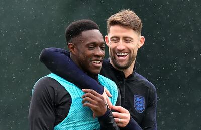 SAINT PETERSBURG, RUSSIA - JULY 04:  Danny Welbeck and Gary Cahill share a joke during an England training session on July 4, 2018 in Saint Petersburg, Russia.  (Photo by Alex Morton/Getty Images)