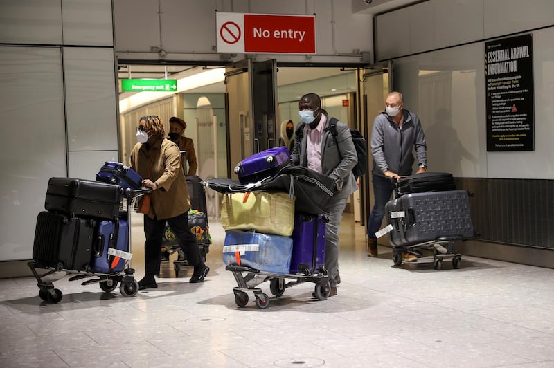 Travellers arrive at Heathrow Airport on Monday morning. Reuters