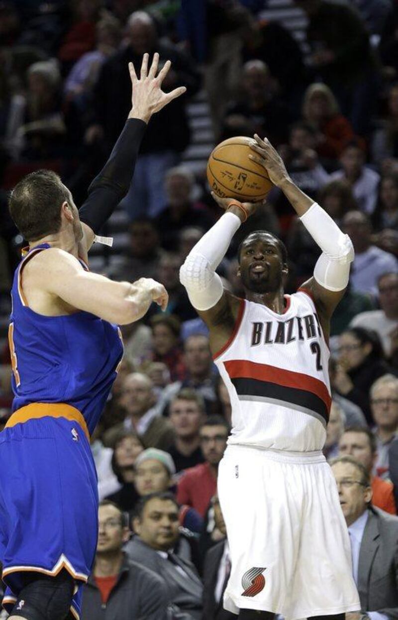 Portland Trail Blazers guard Wesley Matthews, right, shoot a three-pointer against the New York Knicks during his team's NBA victory on Sunday. Don Ryan / AP / December 28, 2014