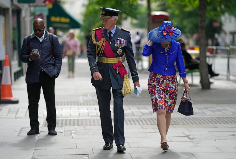 People head for St Paul's Cathedral for the service of thanksgiving for the reign of Queen Elizabeth II. AP
