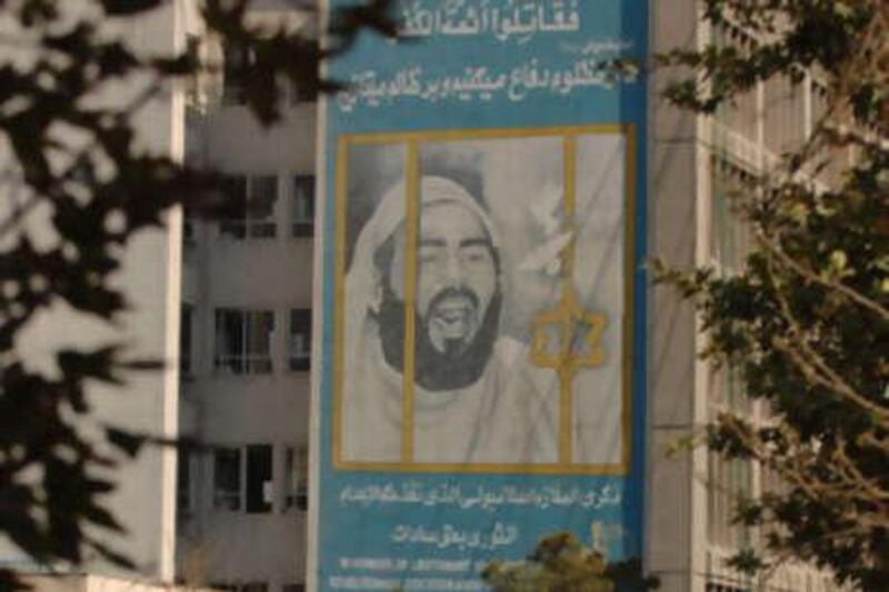 A mural of Khaled el Islambouli, the assassin of Anwar Sadat, hangs over a building in Iran.