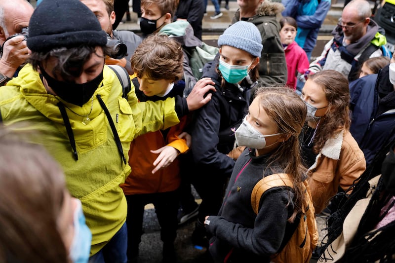 Greta Thunberg leaves after lending her support to campaigners in London. AFP