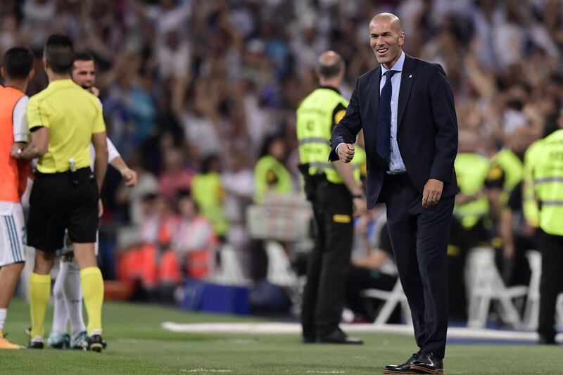 Real Madrid's French coach Zinedine Zidane celebrates their opener during the second leg of the Spanish Supercup football match Real Madrid vs FC Barcelona at the Santiago Bernabeu stadium in Madrid, on August 16, 2017. / AFP PHOTO / JAVIER SORIANO