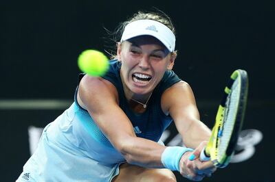 epa07282303 Caroline Wozniacki of Denmark in action against Alison van Uytvanck of Belgium during their women's first round match at the Australian Open Grand Slam tennis tournament in Melbourne, Australia, 14 January 2019.  EPA/DAVID CROSLING AUSTRALIA AND NEW ZEALAND OUT