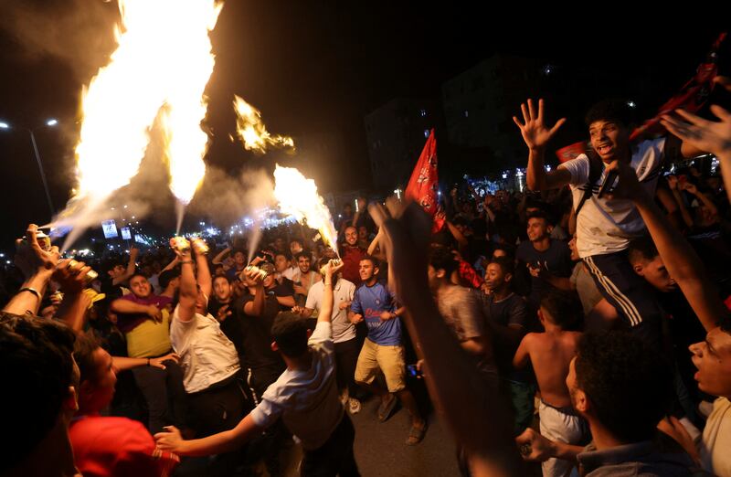 Al Ahly fans celebrate in Cairo's Mokattam district after the victory in the CAF Champions League. Reuters