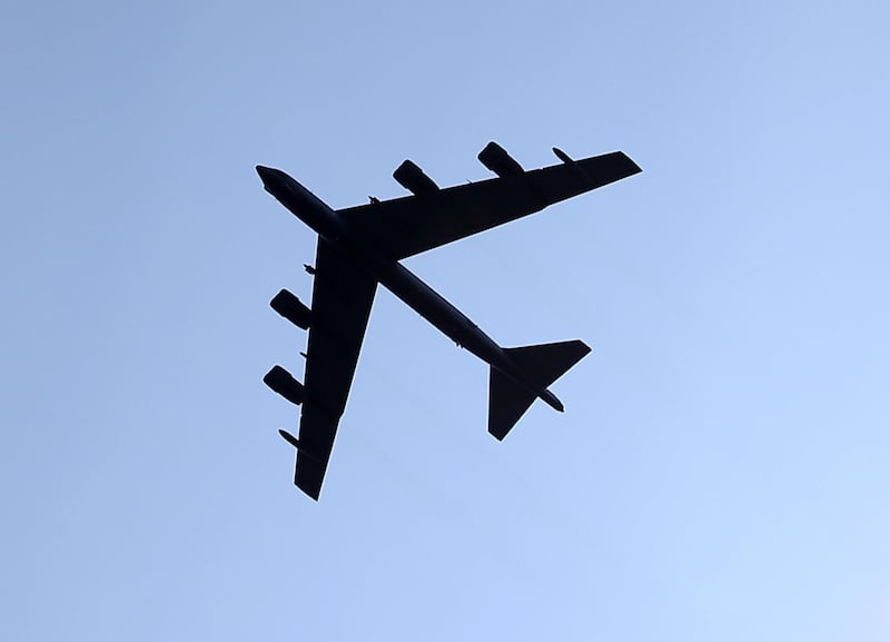 JOINT BASE MYER-HENDERSON HALL, VA - AUGUST 14: A US Air Force B52 flies over a retirement ceremony for US Army Chief of Staff Gen. Ray Odierno at Joint Base Myer-Henderson, August 14, 2015 in Arlington, Virginia. Gen. Odierno who was the Army's 38th Chief of Staff was replaced by Gen. Mark Milley during a Army Chief of Staff Change of Responsibility ceremony.   Mark Wilson/Getty Images/AFP