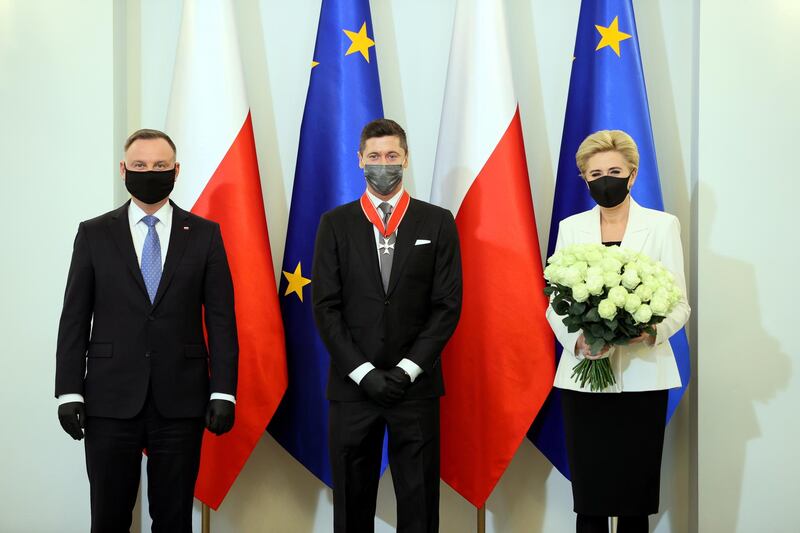 Robert Lewandowski with Polish President Andrzej Duda and First Lady Agata Kornhauser-Duda. EPA
