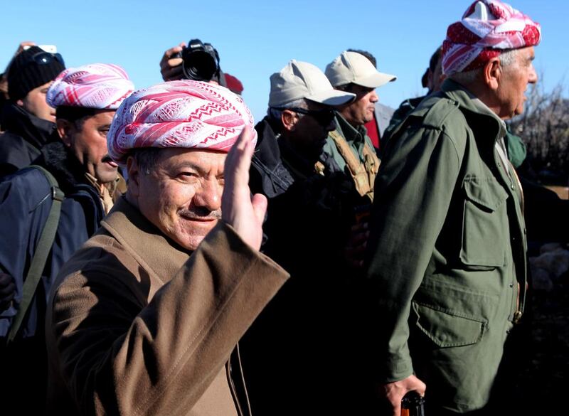 Massoud Barzani, president of the Kurdish regional government in Iraq, arrives on the summit of Mount Sinjar to support Kurdish forces as they head to battle ISIL militants, on December 21, 2014. Zana Ahmed/AP Photo
