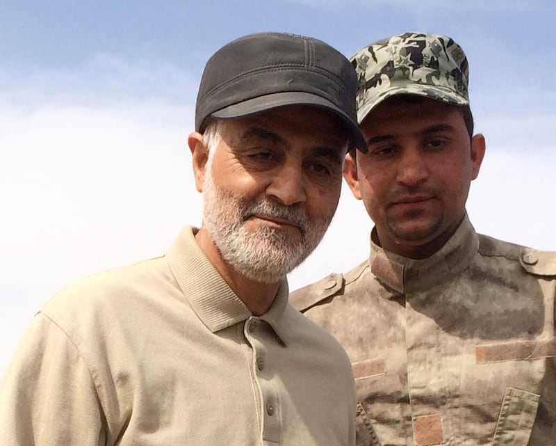 Iranian Revolutionary Guard Commander Qassem Soleimani (L) stands at the frontline during offensive operations against Islamic State militants in the town of Tal Ksaiba in Salahuddin province March 8, 2015. Picture taken March 8, 2015.  REUTERS/Stringer (IRAQ - Tags: CIVIL UNREST CONFLICT POLITICS)