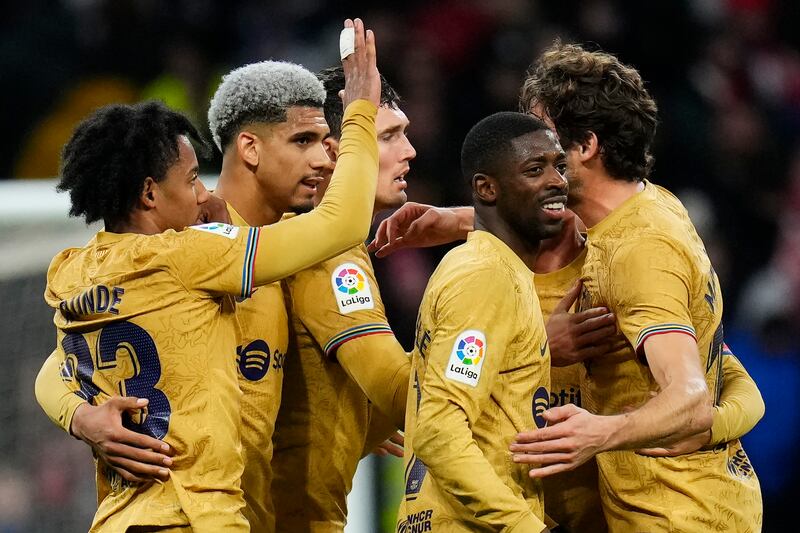 Barcelona's Ousmane Dembele, second from right, celebrates with teammates after opening the scoring against Atletico Madrid at the Metropolitano stadium in Madrid, Spain, Sunday, January 8, 2023. AP Photo