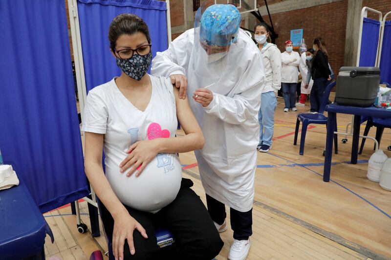 A pregnant woman receives a dose of the Pfizer vaccine against Covid-19 at a centre in Bogota, Colombia, on July 23. EPA