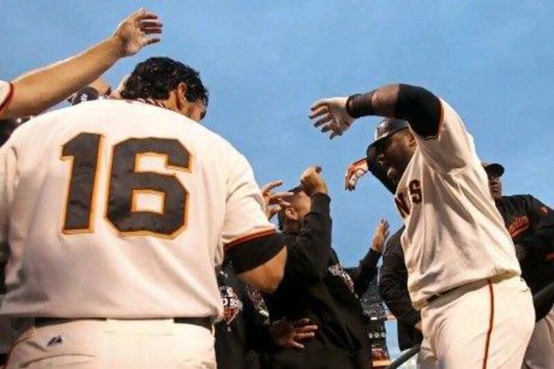 Pablo Sandoval, right, celebrates his two home runs with his San Francisco Giants teammates.