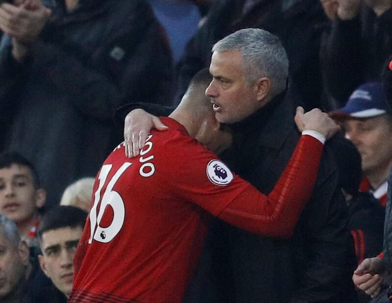 Manchester United's Marcos Rojo is embraced by manager Jose Mourinho after being substituted. Reuters