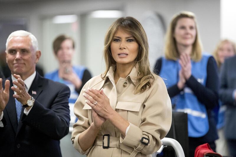 First lady Melania Trump, center, accompanied by Vice President Mike Pence, left, applauds as President Donald Trump speaks to employees at the Federal Emergency Management Agency Headquarters, Wednesday, June 6, 2018, in Washington. (AP Photo/Andrew Harnik)