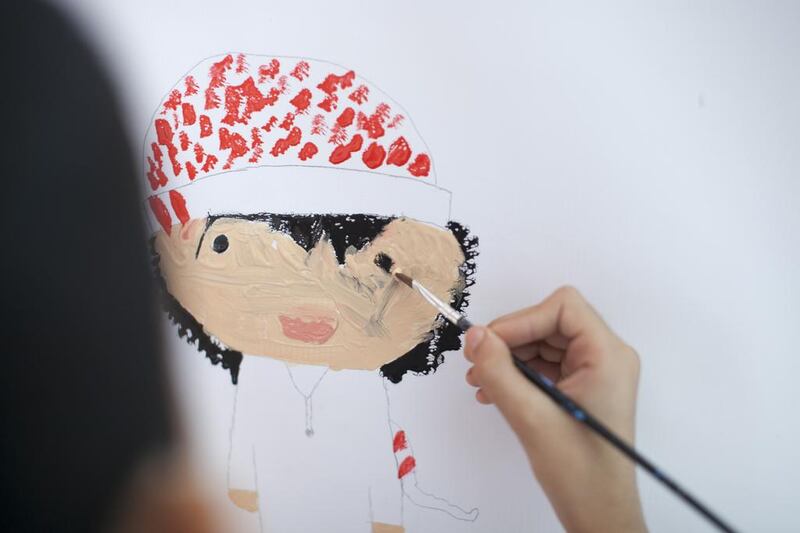 Abdullah Al Rokn, 9, works on his drawing in hopes he would win the Children’s City “The Power in Union” a drawing contest for children in Dubai. Reem Mohammed / The National