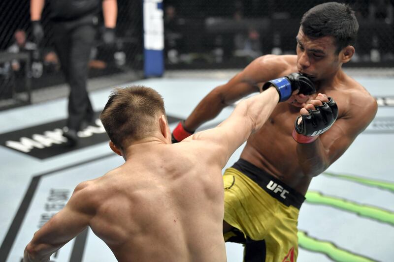 ABU DHABI, UNITED ARAB EMIRATES - JULY 12: (L-R) Zhalgas Zhumagulov of Kazakhstan punches Raulian Paiva of Brazil in their flyweight fight during the UFC 251 event at Flash Forum on UFC Fight Island on July 12, 2020 on Yas Island, Abu Dhabi, United Arab Emirates. (Photo by Jeff Bottari/Zuffa LLC)