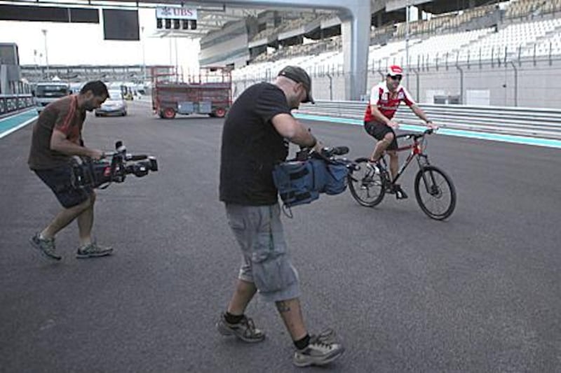 The eyes of the world will be on the championship leader Fernando Alonso, who takes a cycle tour round the Yas Marina Circuit.