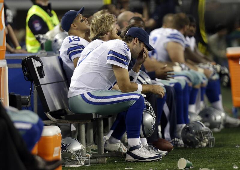 Dallas Cowboys quarterback Tony Romo grimaces in the final minutes of his team's home loss to the Green Bay Packers. Tim Sharp / AP Photo