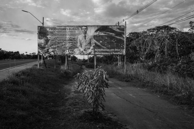 This image provided by World Press Photo, part of a series titled Amazonian Dystopia, by Lalo de Almeida for Folha de Sao Paulo/Panos Pictures which won the World Press Photo Long-Term Project award,, shows A billboard with a message of support to President Bolsonaro stands alongside the Trans-Amazonian Highway, Altamira, Para, Brazil, July 20, 2020.  It was financed by local farmers.  Agribusiness is one of the president's main pillars of political support (Lalo de Almeida for Folha de Sao Paulo / Panos Pictures / World Press Photo via AP)