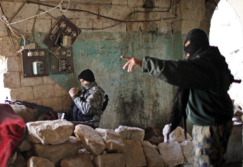 Fighters from Jabhat Fateh Sham, formerly Jabhat Al Nusra, take their positions during a clash with Syrian government forces in Aleppo. (Ahmed Jadallah / Reuters)