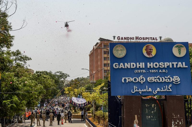 An Indian Air Force helicopter drops rose petals at the Gandhi Hospital in Hyderabad. AFP