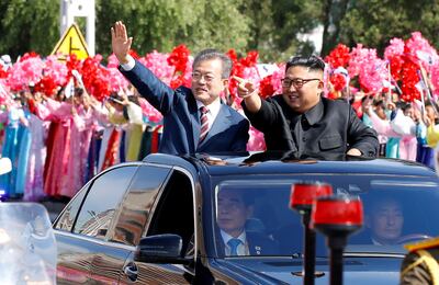 South Korean President Moon Jae-in and North Korean leader Kim Jong Un wave during a car parade in Pyongyang, North Korea, September 18, 2018. Pyeongyang Press Corps/Pool via REUTERS      TPX IMAGES OF THE DAY