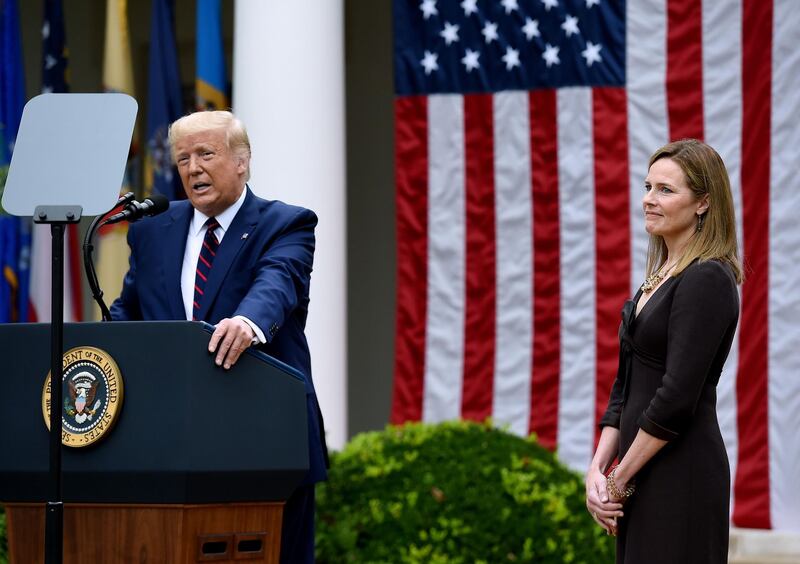 US President Donald Trump speaks next to Judge Amy Coney Barrett at the Rose Garden of the White House in Washington. AFP