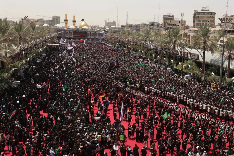 Shiite Muslims take part in the Tuwairij run ritual as they mark Ashura, in Karbala, Iraq. All photos: AFP