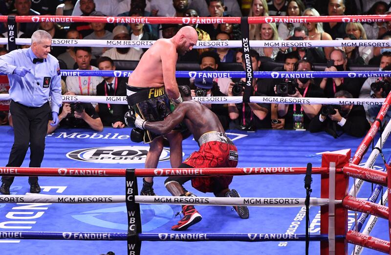 WBC heavyweight champion Tyson Fury knocks out US challenger Deontay Wilder in the 11th round. AFP