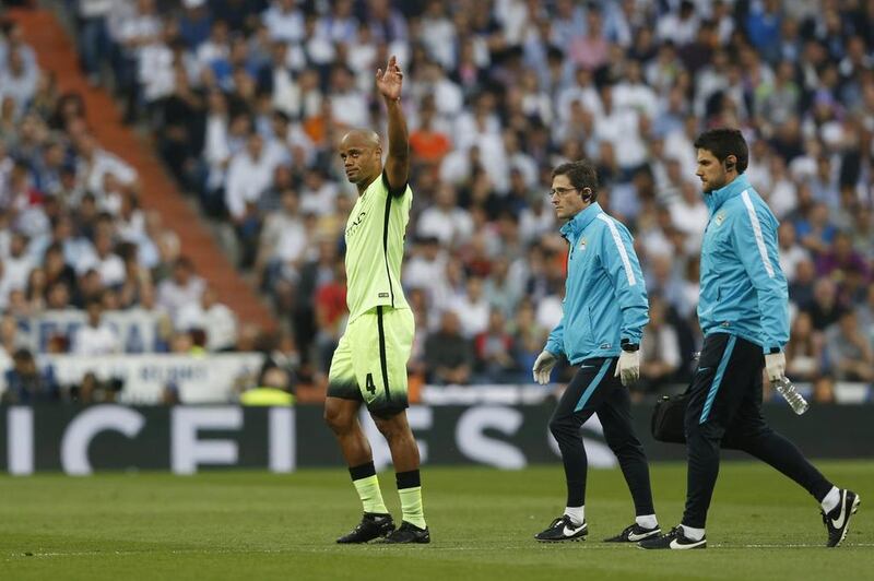 Manchester City’s Vincent Kompany waves to fans as he walks off to be substituted after sustaining an injury. Carl Recine / Reuters