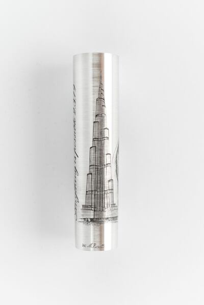 The barrel of Polly Phillips's Montegrappa pen is engraved with an image of the Burj Khalifa 