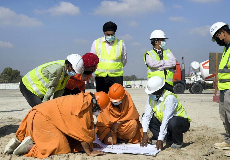 Abu Dhabi, United Arab Emirates - Head priests also discuss with contractors and partake in the construction of Bochasanwasi Shri Akshar Purushottam Swaminarayan Sanstha also known as, BAPS Hindu temple in Abu Dhabi. Khushnum Bhandari for The National